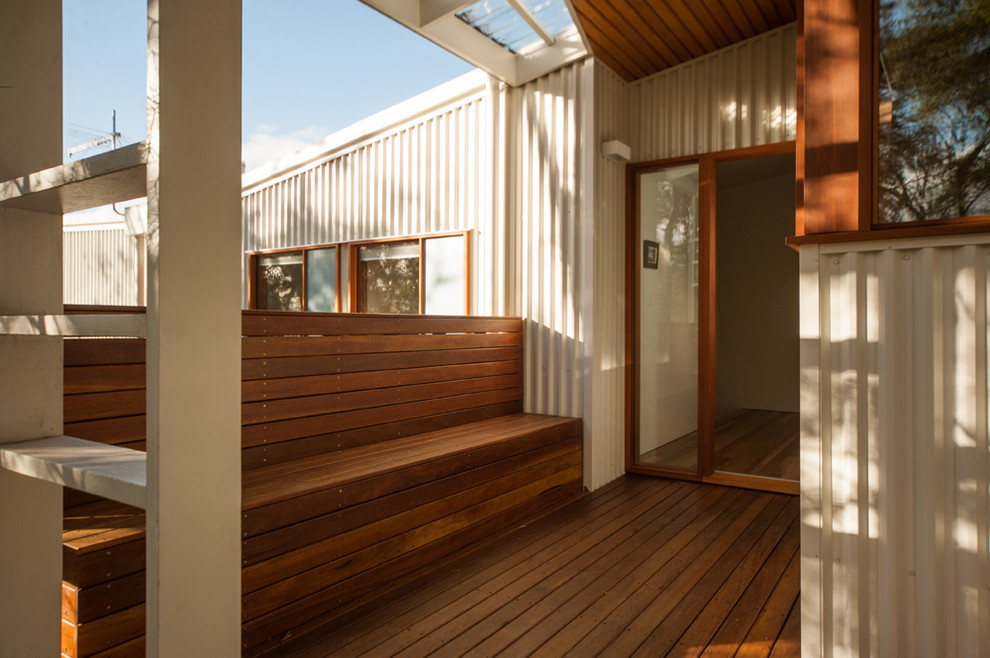 This is an example of a contemporary entryway in Hobart with a single front door.