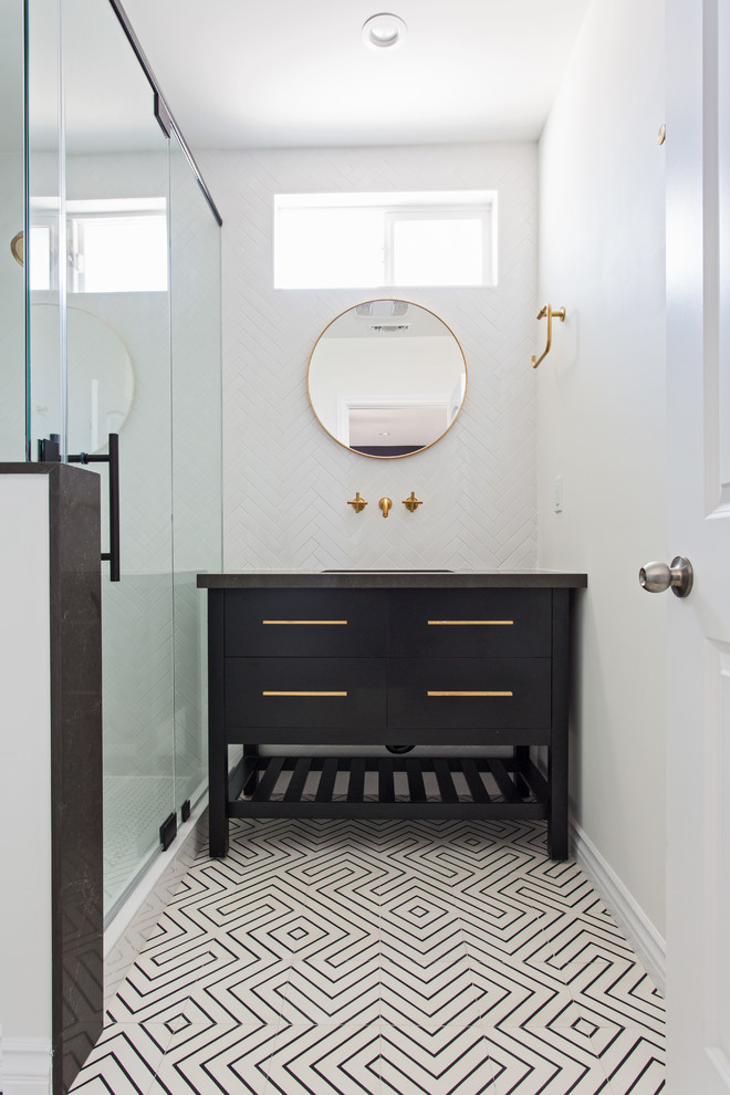 Inspiration for a mid-sized contemporary master bathroom in Los Angeles with flat-panel cabinets, black cabinets, a corner shower, a wall-mount toilet, white tile, subway tile, white walls, cement tiles, an undermount sink, engineered quartz benchtops, a hinged shower door and multi-coloured floor.