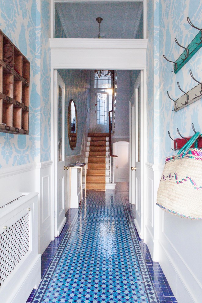 Design ideas for a modern hallway in London with blue floor.