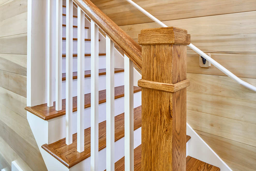 Design ideas for a transitional wood straight staircase in Charleston with painted wood risers.