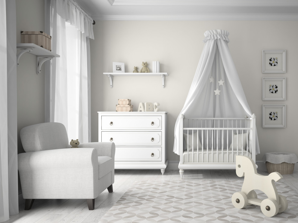 Ejemplo de dormitorio infantil de 1 a 3 años tradicional de tamaño medio con paredes beige, suelo de madera clara, suelo gris y madera