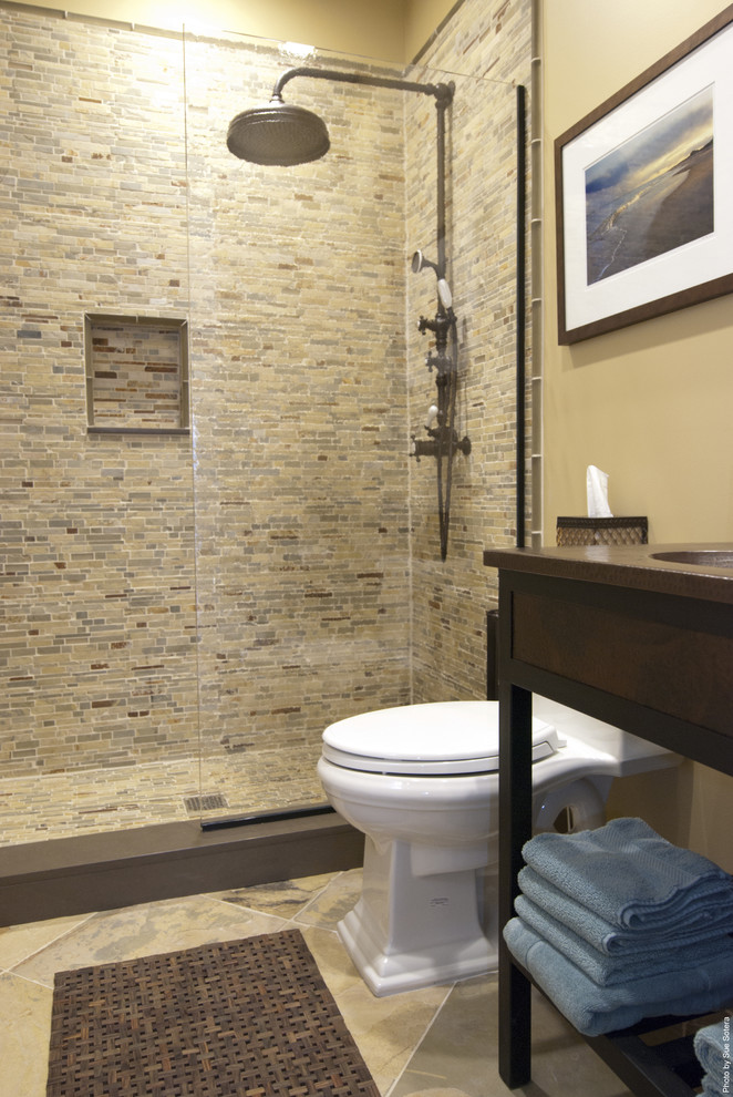 Photo of a contemporary bathroom in New York with stone tile.