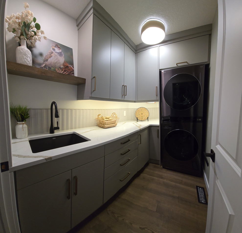 Transitional laundry room photo in Edmonton