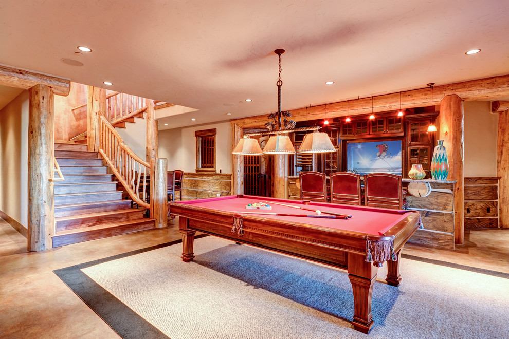 Large mountain style walk-out beige floor basement photo with beige walls