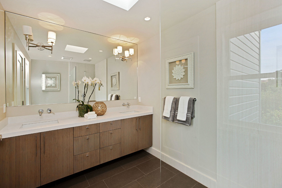 This is an example of a transitional master bathroom in San Francisco with an undermount sink, flat-panel cabinets, medium wood cabinets, a curbless shower, brown tile, beige walls, quartzite benchtops and stone tile.