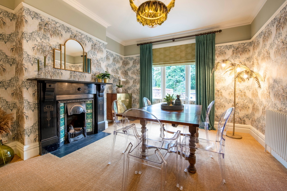 Inspiration for a traditional dining room in Other with multi-coloured walls, carpet, a standard fireplace, a tiled fireplace surround, brown floors and wallpapered walls.