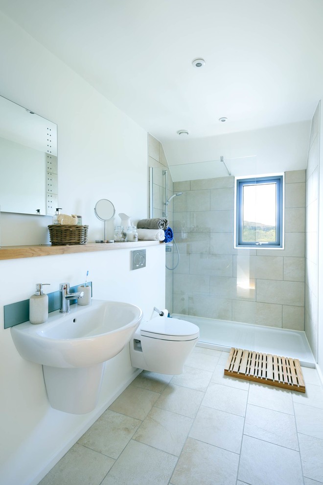 This is an example of a mid-sized contemporary master bathroom in Other with beaded inset cabinets, light wood cabinets, a curbless shower, a wall-mount toilet, orange tile, ceramic tile, white walls, ceramic floors, a drop-in sink and wood benchtops.