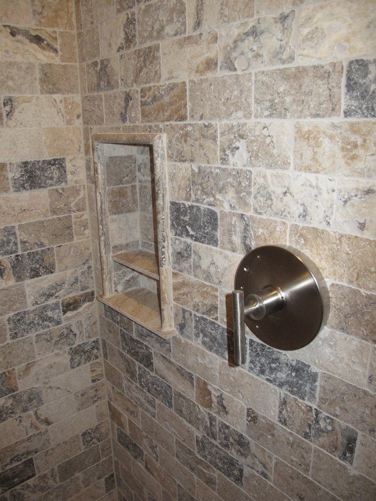 This is an example of a country bathroom in Atlanta with beige tile, stone tile and travertine floors.