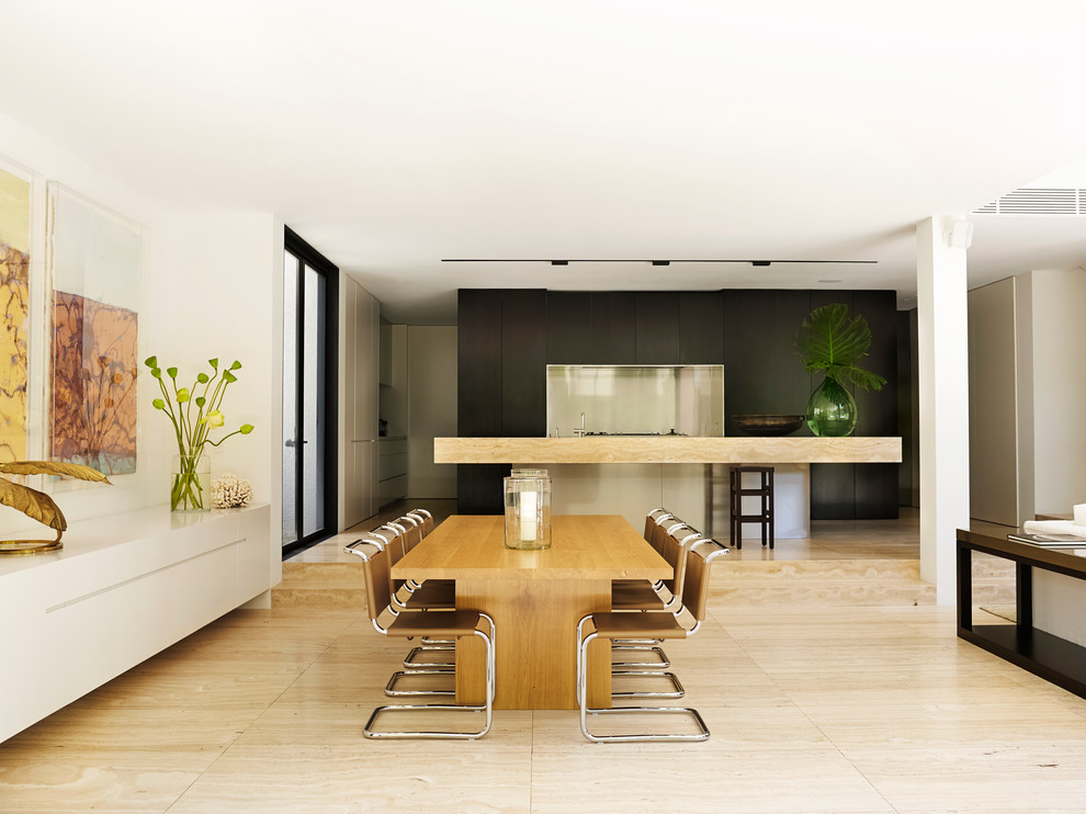 This is an example of a contemporary open plan dining in Sydney with white walls and light hardwood floors.