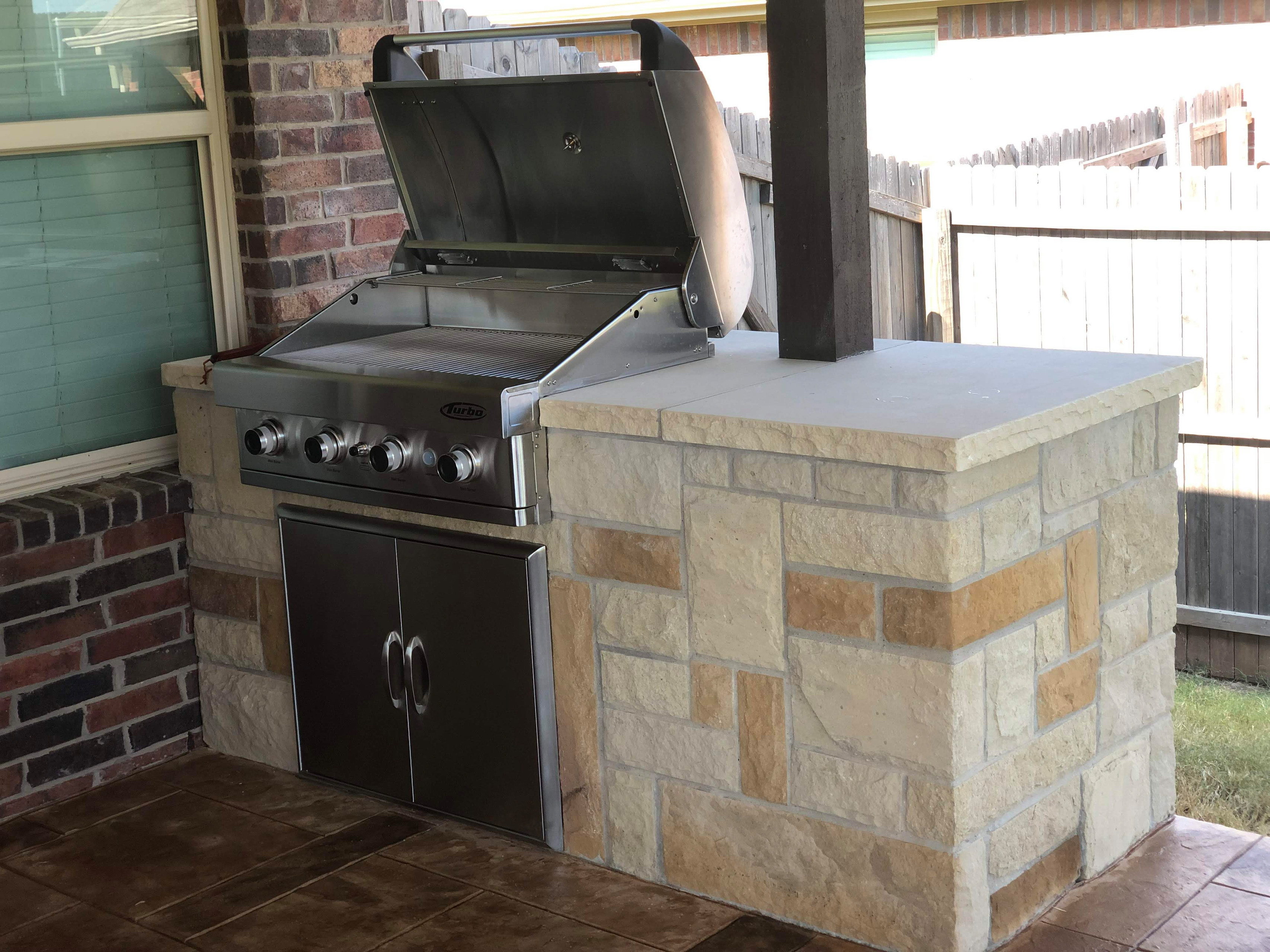 Custom stone grill station and patio remodeling