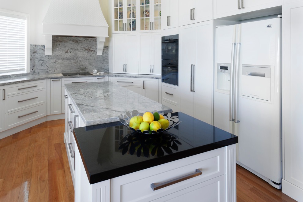 Inspiration for a traditional kitchen in Perth with white cabinets, granite benchtops, grey splashback, stone slab splashback, multiple islands, shaker cabinets and grey benchtop.