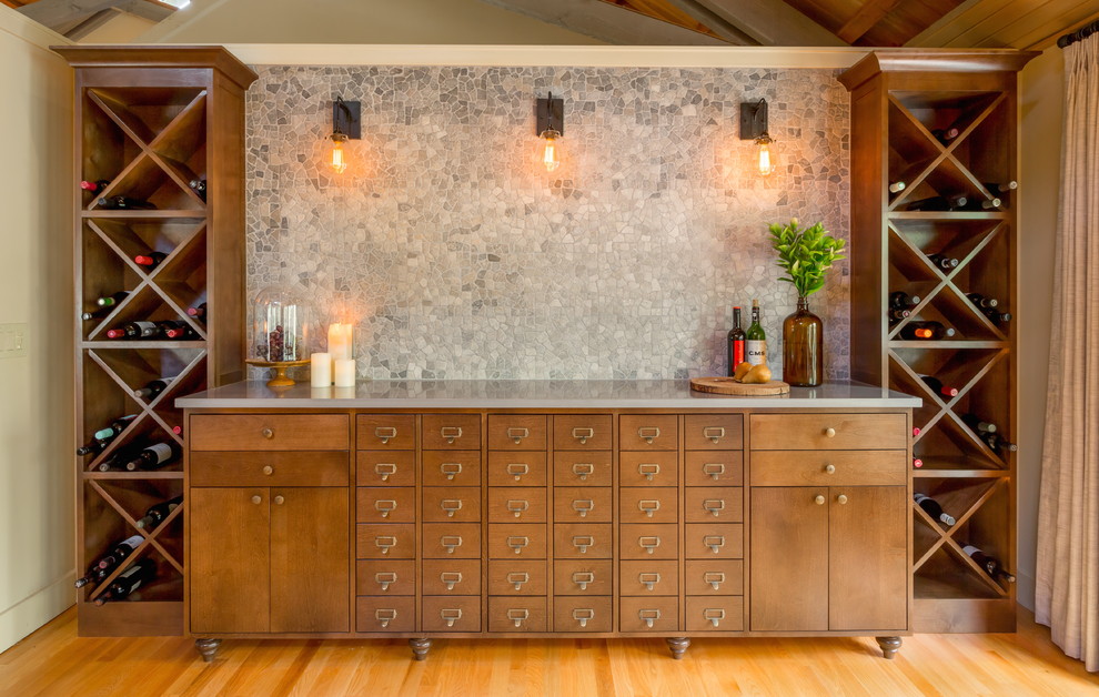 This is an example of a transitional wine cellar in Seattle with medium hardwood floors and diamond bins.