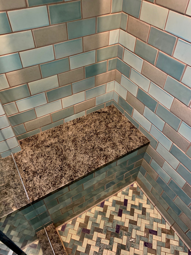 Inspiration for a small traditional 3/4 bathroom in Minneapolis with an alcove shower, a one-piece toilet, blue tile, ceramic tile, blue walls, ceramic floors, a pedestal sink, green floor, a hinged shower door, a shower seat and a single vanity.