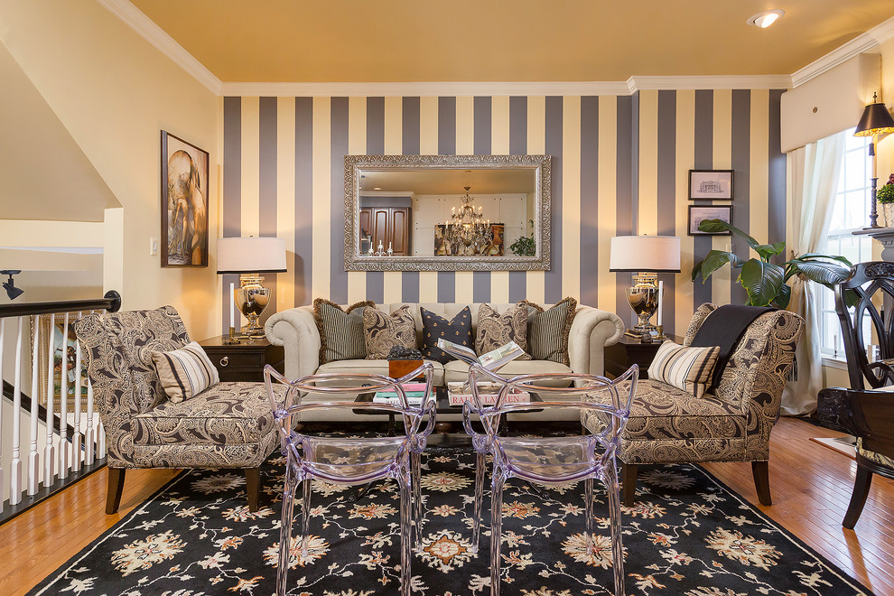Eclectic formal loft-style living room in Philadelphia with yellow walls, medium hardwood floors and brown floor.