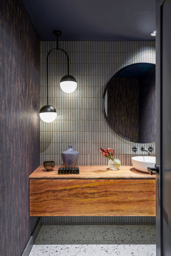 Photo of a mid-sized contemporary powder room in Sydney with flat-panel cabinets, red cabinets, a one-piece toilet, gray tile, mosaic tile, blue walls, terrazzo floors, a vessel sink, travertine benchtops, white floor, red benchtops, a floating vanity, wallpaper and wallpaper.