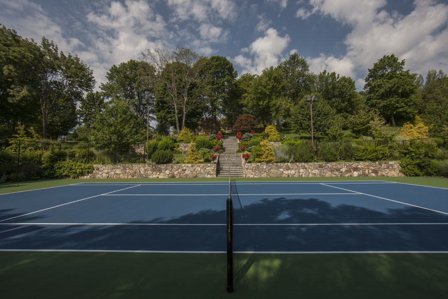 Photo of a large traditional backyard outdoor sport court in New York with a vegetable garden.