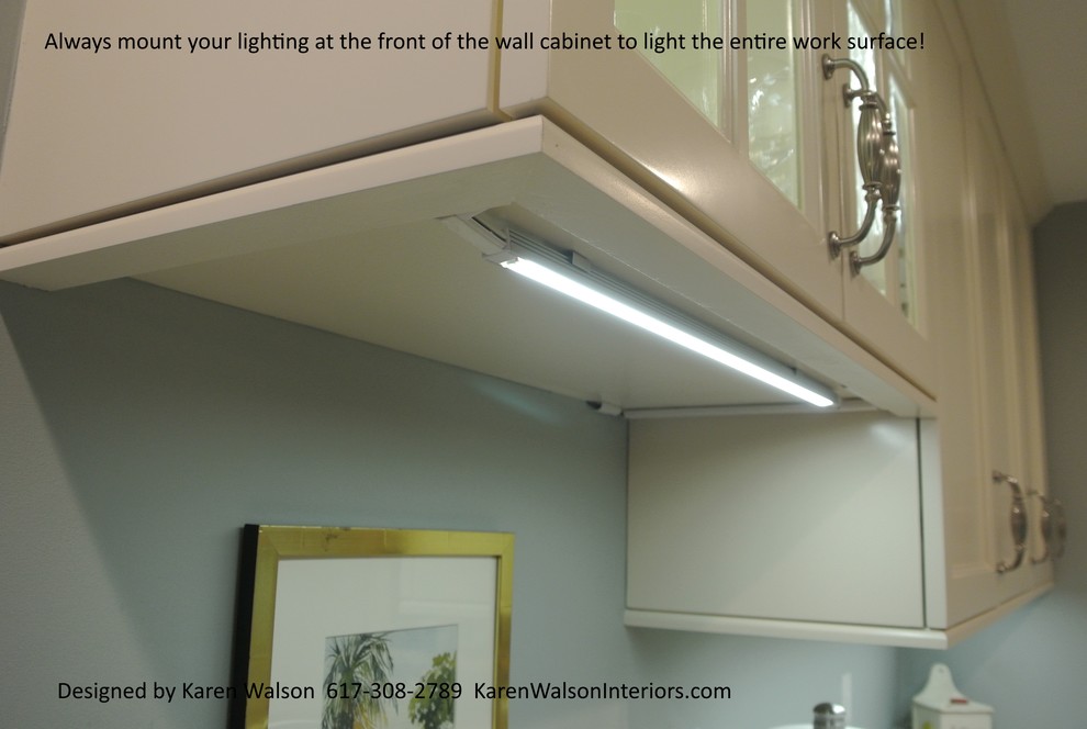 Small transitional galley light wood floor eat-in kitchen photo in Boston with an undermount sink, recessed-panel cabinets, white cabinets, granite countertops, stone slab backsplash, stainless steel appliances and a peninsula