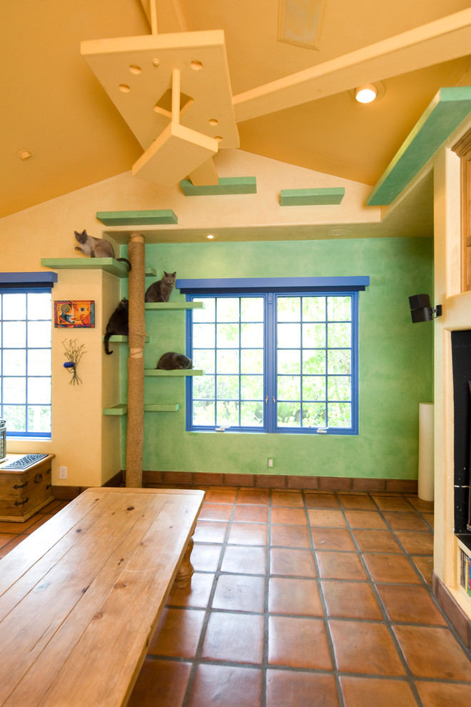 Photo of an eclectic family room in Santa Barbara with green walls.