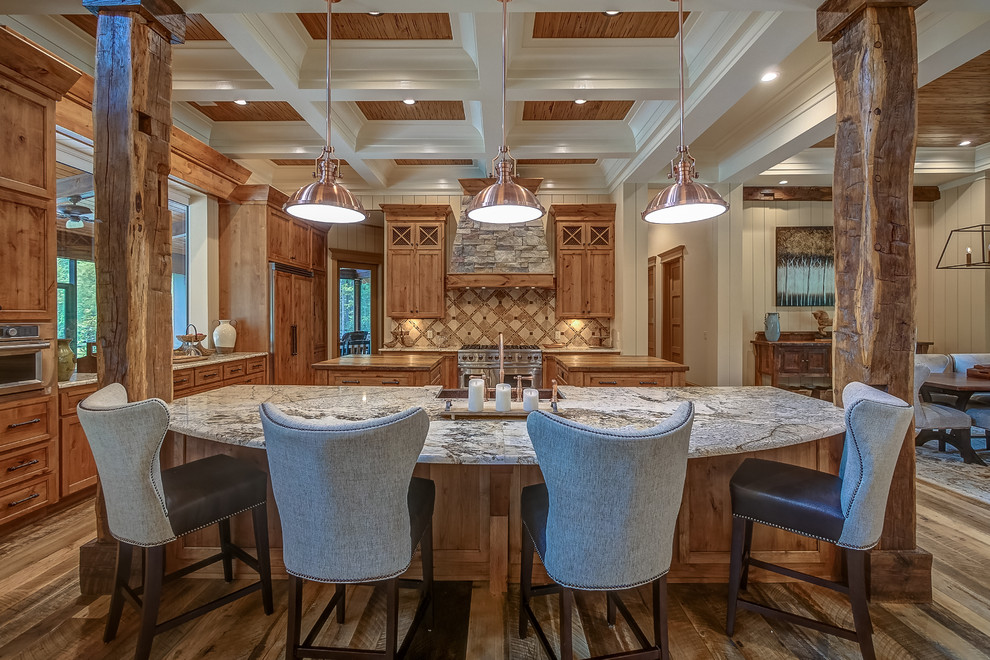 Photo of a country eat-in kitchen in Atlanta with shaker cabinets, medium wood cabinets, multi-coloured splashback, stainless steel appliances, medium hardwood floors, multiple islands and multi-coloured benchtop.