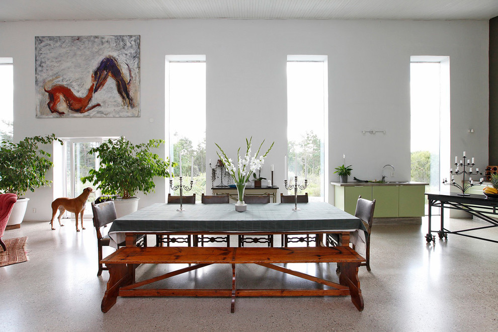 Inspiration for a mid-sized eclectic open plan dining in Stockholm with white walls and no fireplace.