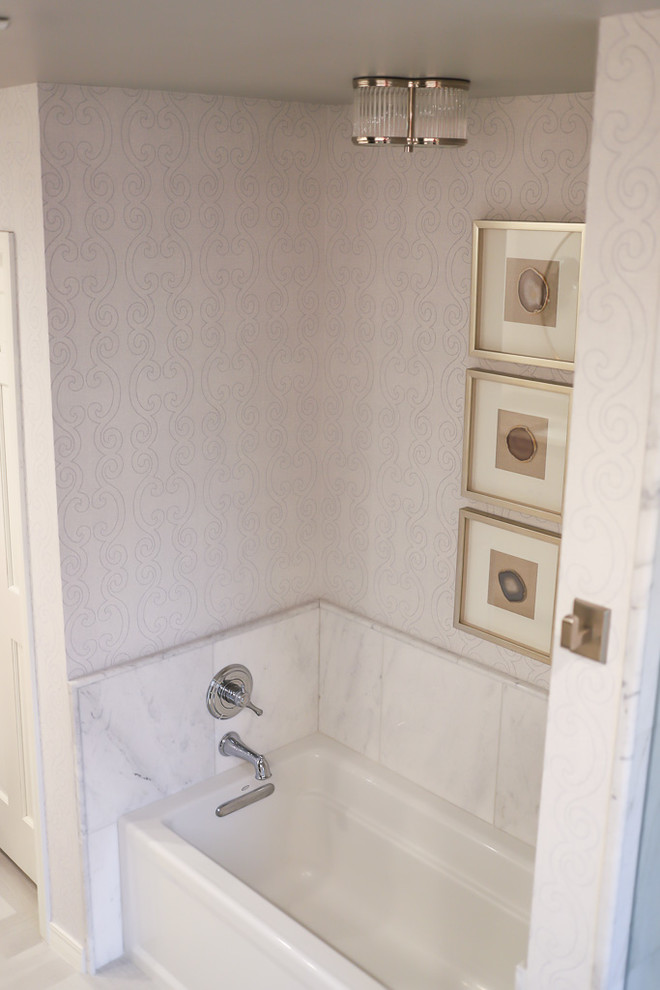 Example of a mid-sized transitional master white tile and marble tile ceramic tile and gray floor alcove bathtub design with gray walls, beaded inset cabinets, white cabinets, a two-piece toilet, an undermount sink, quartzite countertops and a hinged shower door