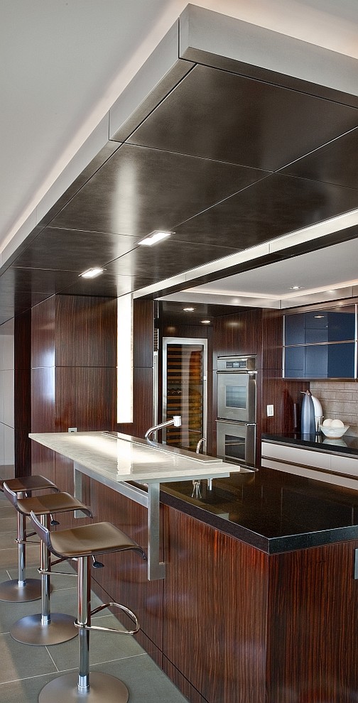 Inspiration for a contemporary kitchen in Seattle with stainless steel appliances, glass benchtops and black benchtop.