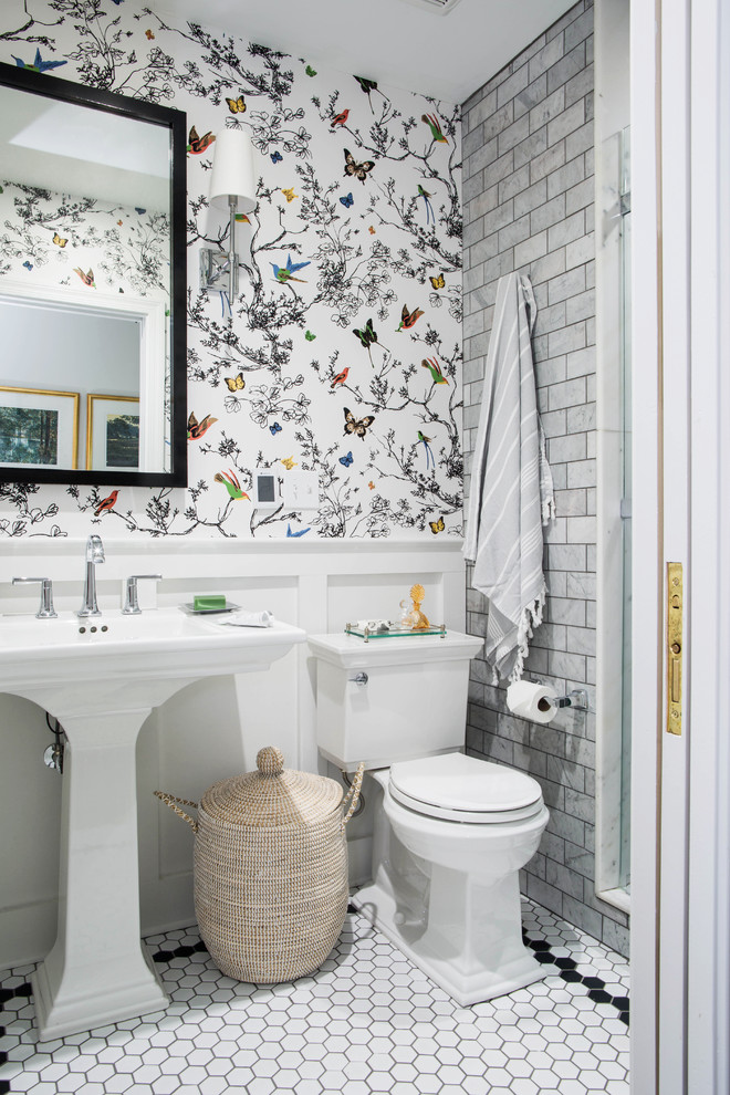 Photo of a traditional bathroom in Other with an alcove shower, gray tile, subway tile, white walls, mosaic tile floors, a pedestal sink and white floor.