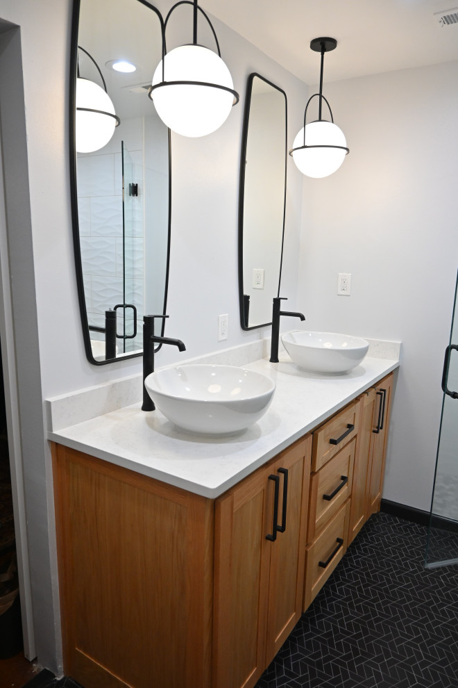 Mid-sized minimalist master white tile and porcelain tile marble floor, black floor and double-sink alcove shower photo in Other with shaker cabinets, light wood cabinets, a two-piece toilet, gray walls, a vessel sink, quartz countertops, a hinged shower door, white countertops, a niche and a built-in vanity
