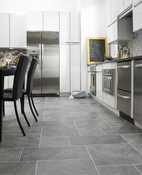 Inspiration for a transitional l-shaped ceramic tile kitchen remodel with flat-panel cabinets, white cabinets, gray backsplash, metal backsplash and stainless steel appliances