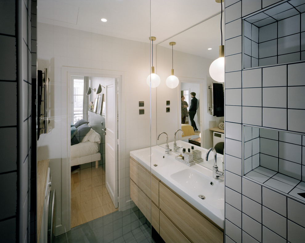 This is an example of a mid-sized contemporary master bathroom in Paris with brown cabinets, an open shower, white tile, ceramic tile, white walls, ceramic floors, a console sink and grey floor.