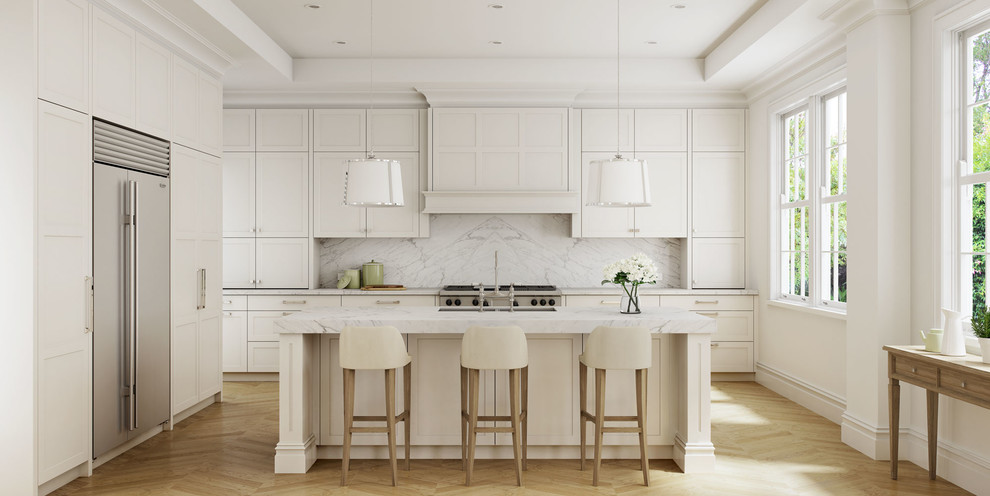 This is an example of an expansive traditional l-shaped eat-in kitchen in Sydney with an undermount sink, shaker cabinets, white cabinets, marble benchtops, stone slab splashback, stainless steel appliances, light hardwood floors and with island.