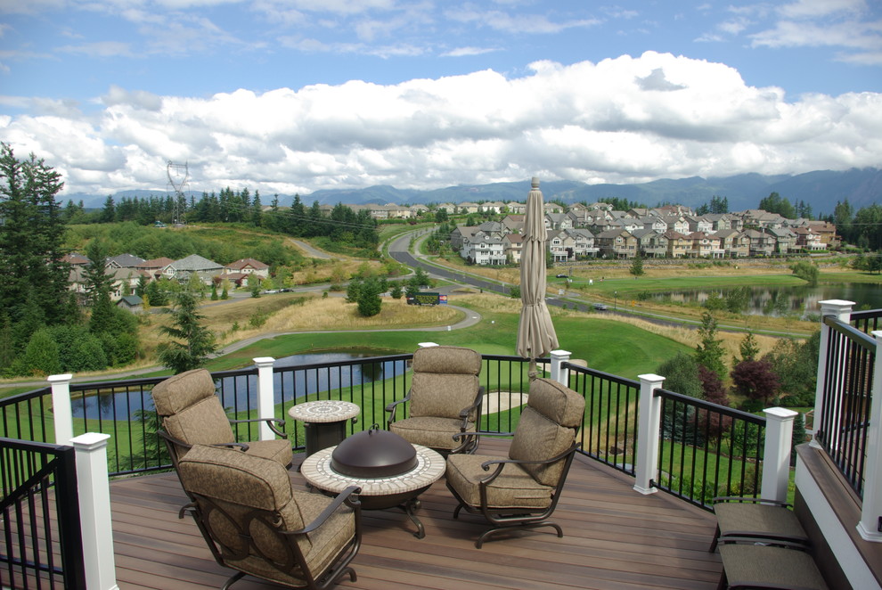 Example of a transitional backyard balcony deck design in Seattle with no cover