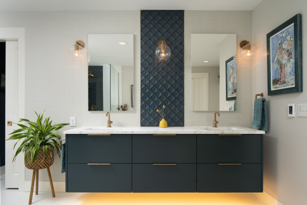Design ideas for a mid-sized modern master bathroom in Minneapolis with flat-panel cabinets, blue cabinets, an undermount tub, a corner shower, a bidet, blue tile, glass tile, grey walls, porcelain floors, an undermount sink, marble benchtops, white floor, a hinged shower door, white benchtops, an enclosed toilet, a double vanity and a floating vanity.