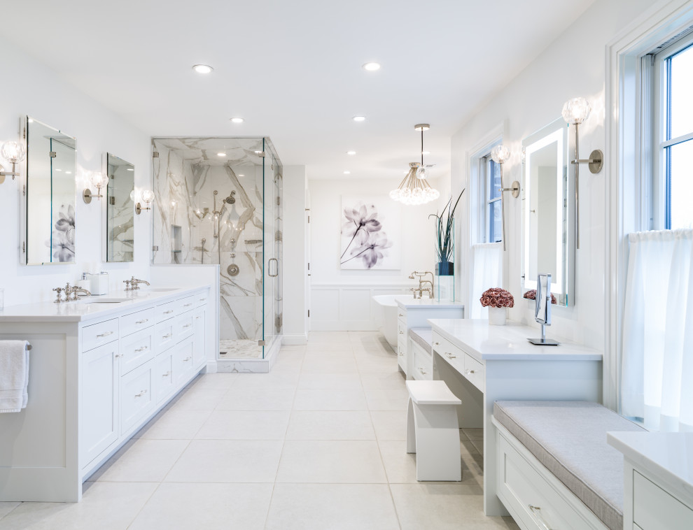 Photo of an expansive traditional ensuite bathroom in Philadelphia with double sinks, shaker cabinets, white cabinets, a freestanding bath, an alcove shower, grey tiles, white tiles, white walls, a submerged sink, engineered stone worktops, white floors, a hinged door, white worktops and a built in vanity unit.