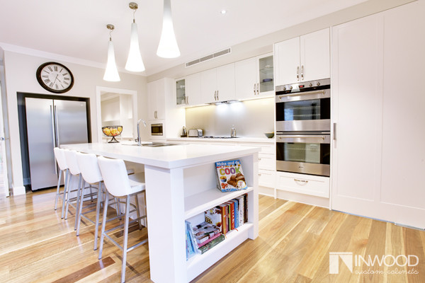 Contemporary eat-in kitchen in Sydney with shaker cabinets and with island.