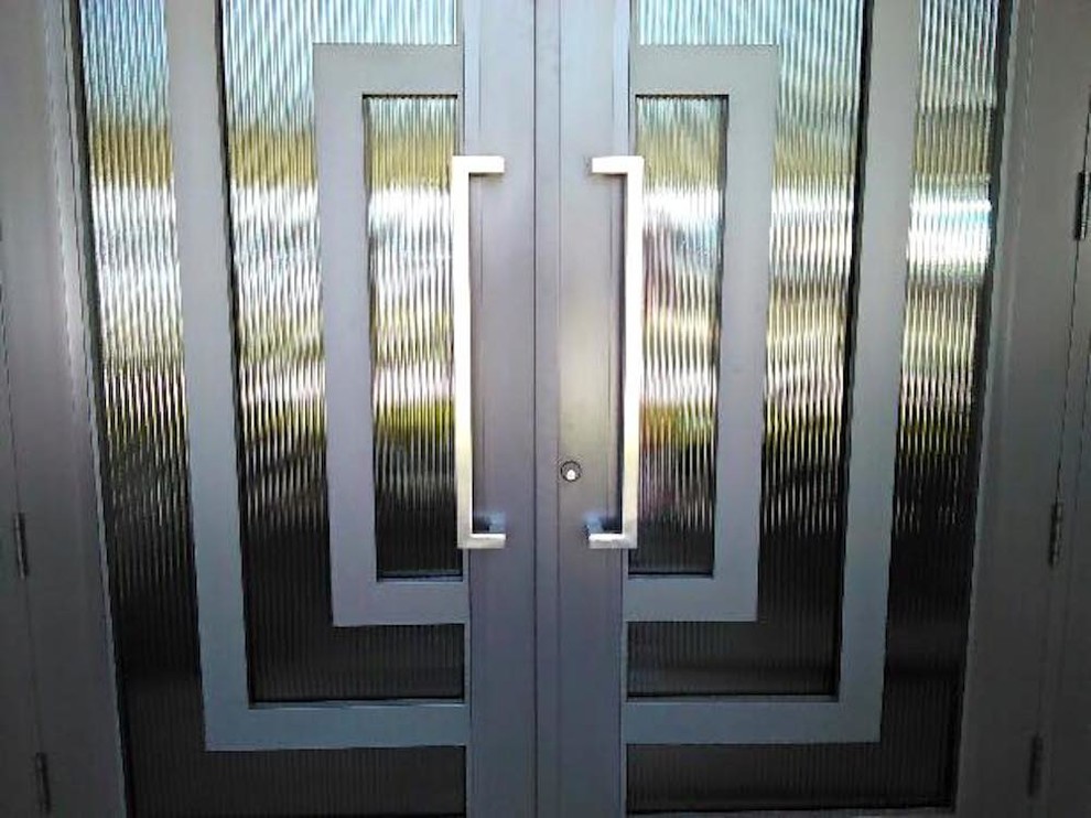 Front door - mid-sized front door idea in Miami with a black front door