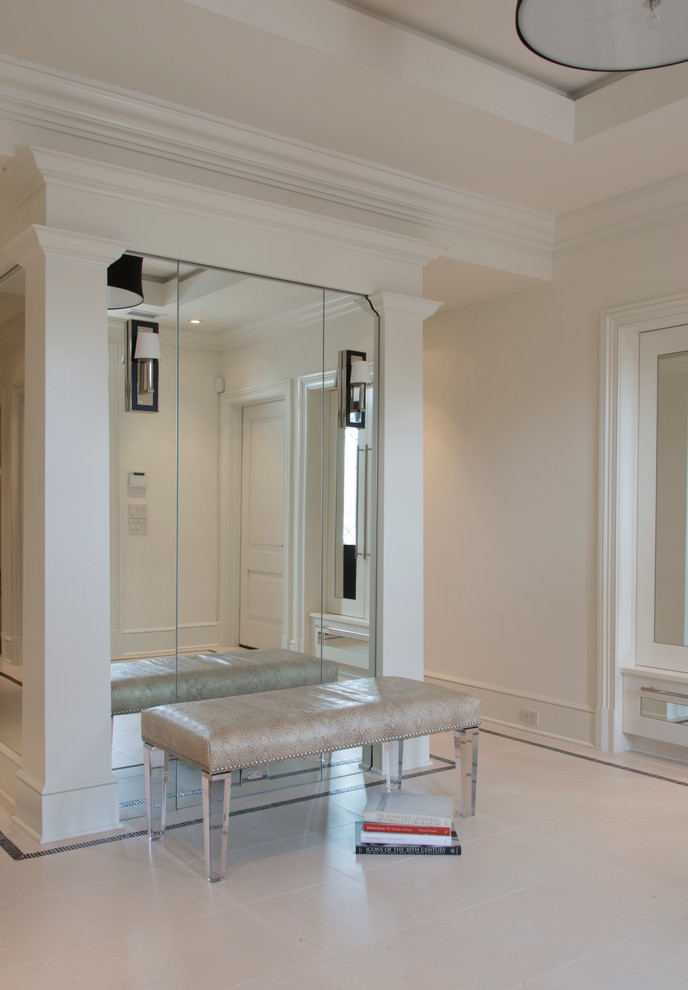 Example of a mid-sized transitional limestone floor vestibule design in DC Metro with white walls