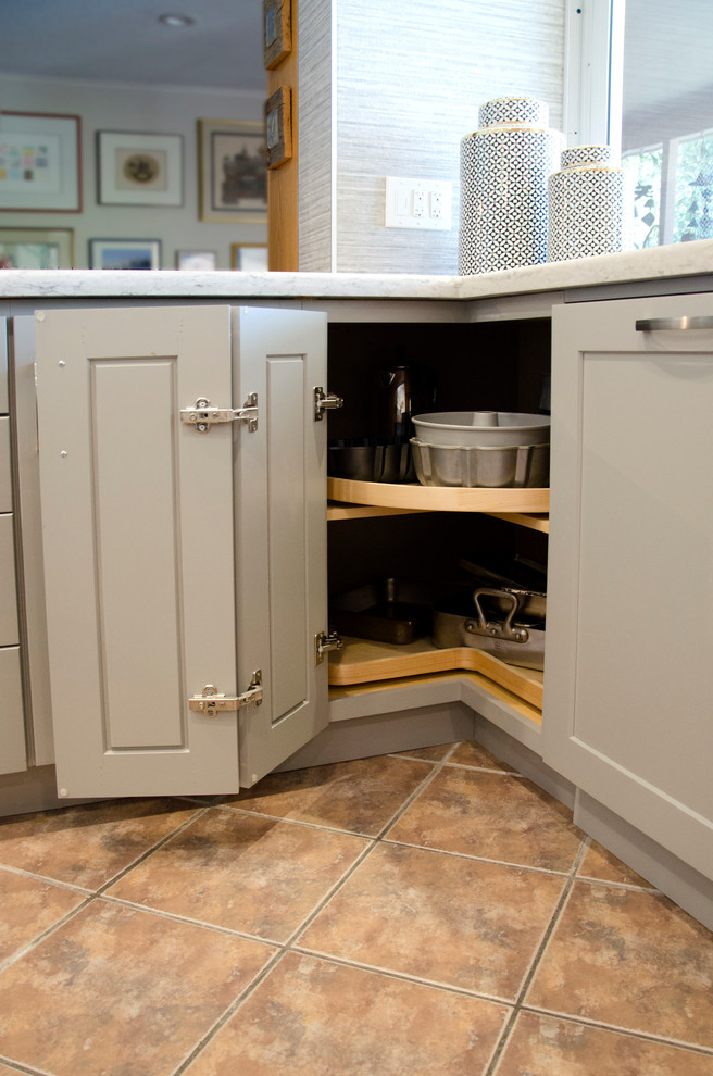 Open concept kitchen - mid-sized transitional u-shaped open concept kitchen idea in Miami with an undermount sink, shaker cabinets, gray cabinets, quartzite countertops, gray backsplash, porcelain backsplash, stainless steel appliances and an island