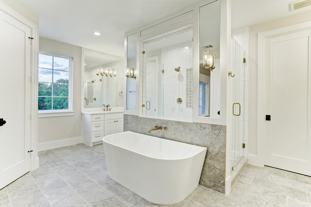 Design ideas for a large transitional master bathroom in Houston with shaker cabinets, white cabinets, a freestanding tub, a double shower, porcelain floors, an undermount sink, engineered quartz benchtops, a hinged shower door, white benchtops, a shower seat, a double vanity and a built-in vanity.