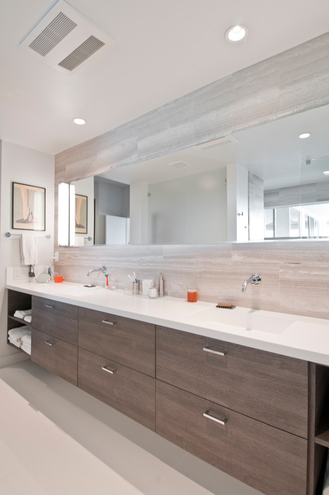 Large modern master bathroom in Los Angeles with flat-panel cabinets, brown cabinets, an open shower, gray tile, limestone, white walls, porcelain floors, an undermount sink, beige floor and an open shower.