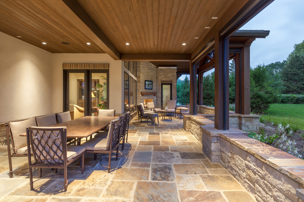 Patio - rustic backyard stone patio idea in Denver