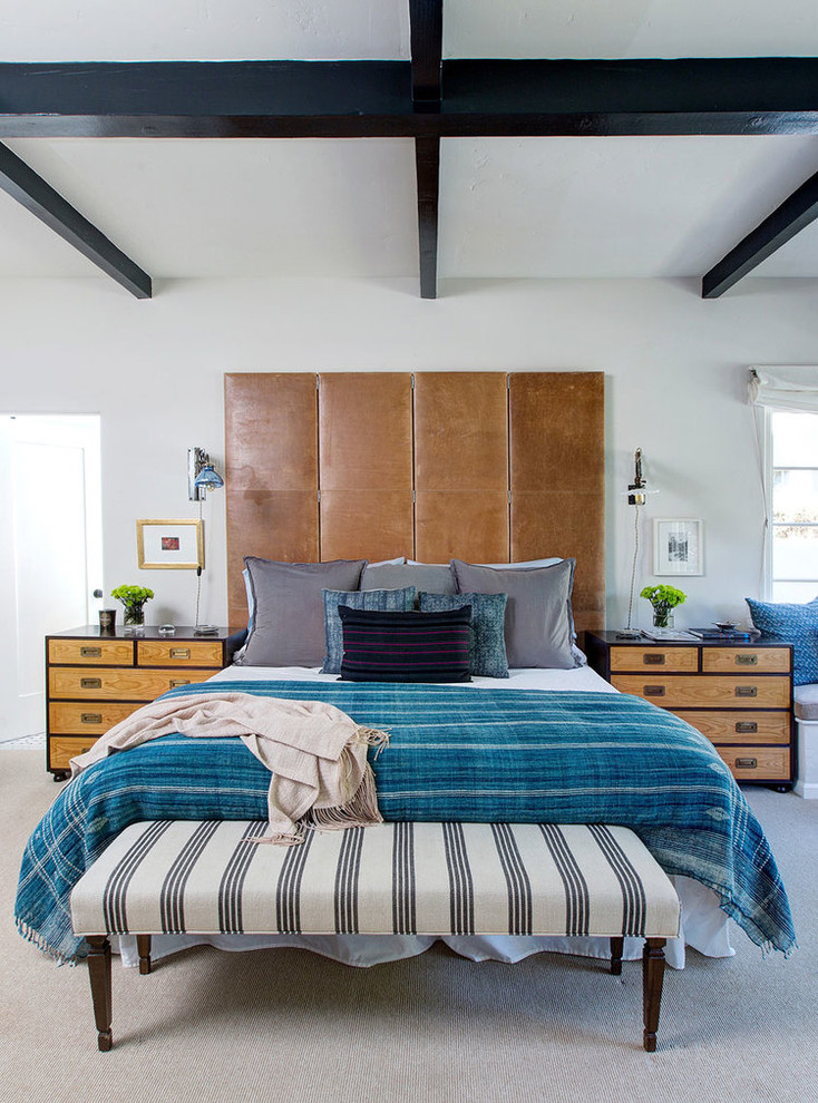 Inspiration for a mediterranean bedroom in Los Angeles with white walls and carpet.