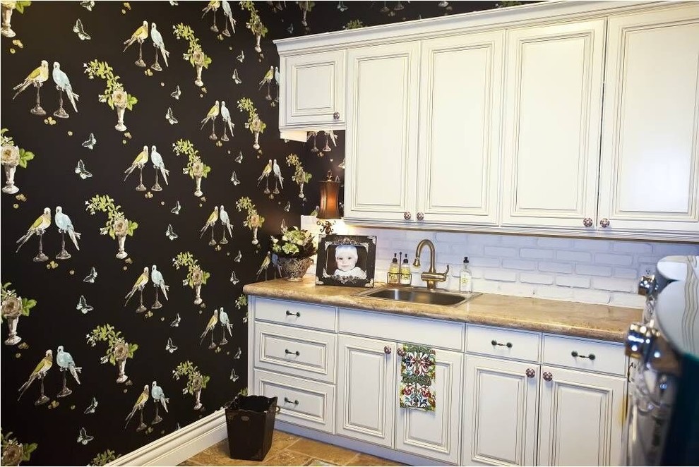Kitchen - small transitional travertine floor and brown floor kitchen idea in Phoenix with a drop-in sink, raised-panel cabinets, white cabinets, white backsplash and brick backsplash