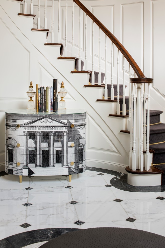 Inspiration for a large traditional foyer in New York with white walls and marble floors.