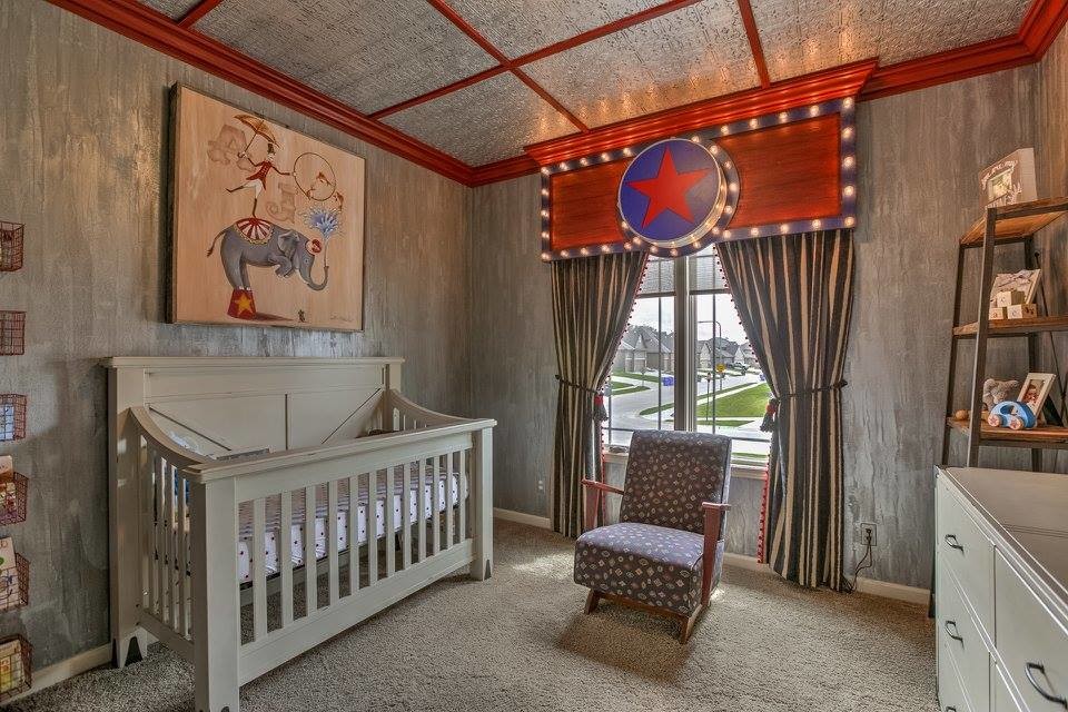 Example of a large transitional boy carpeted and beige floor nursery design in Omaha with gray walls