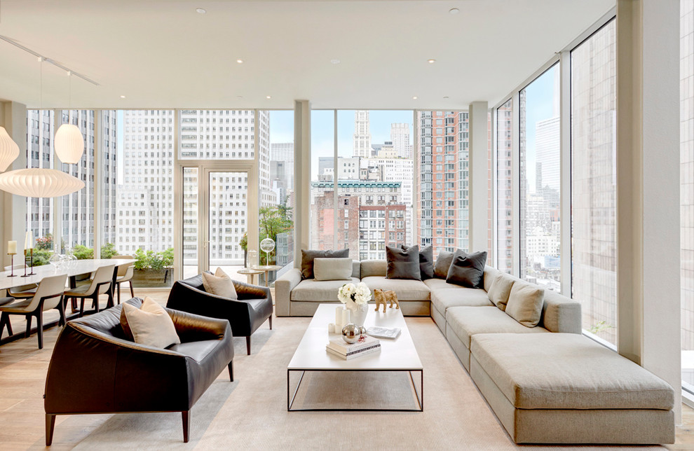 This is an example of a contemporary open concept living room in New York.