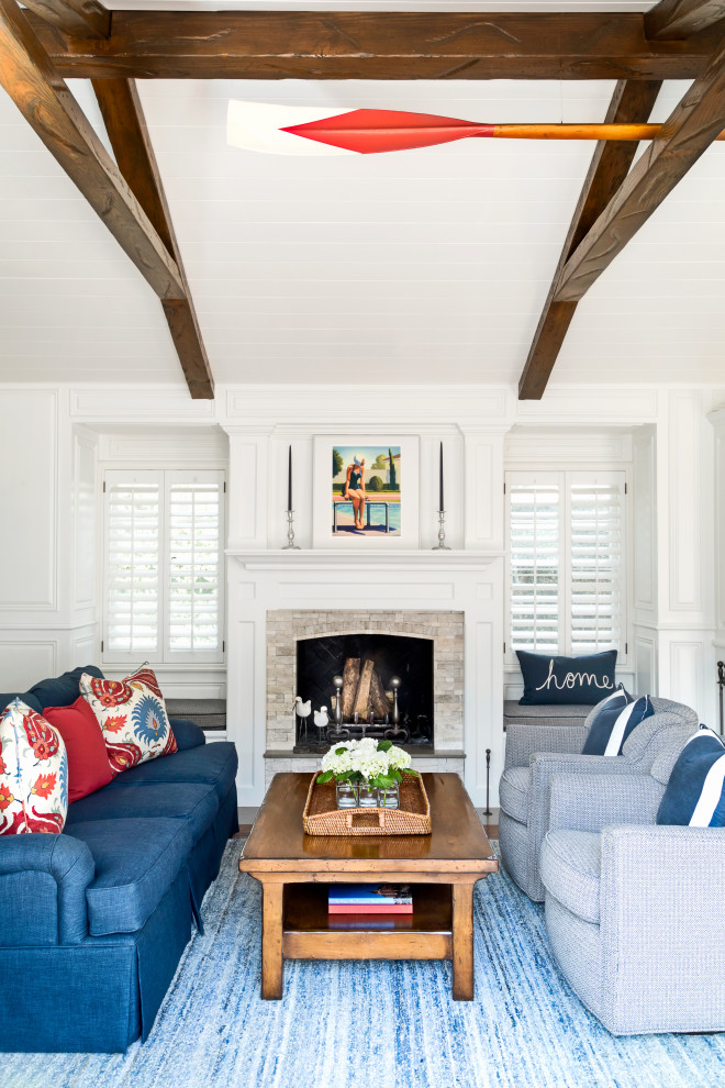 Mid-sized traditional formal open concept living room in Los Angeles with white walls, a standard fireplace, a stone fireplace surround, no tv, exposed beam and decorative wall panelling.