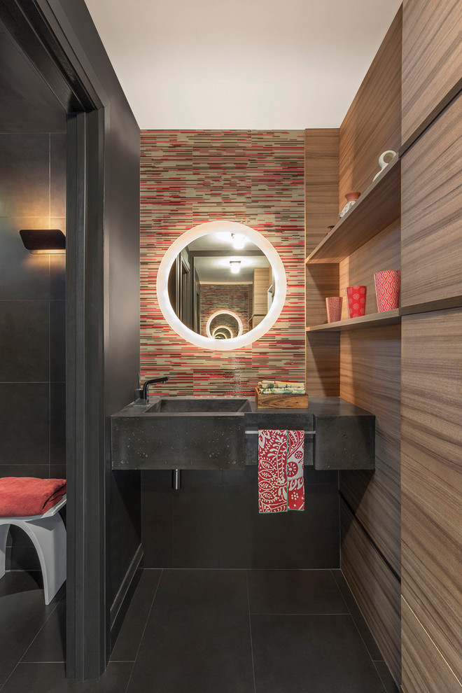 Inspiration for a contemporary bathroom in Toronto with multi-coloured tile, an integrated sink and grey floor.