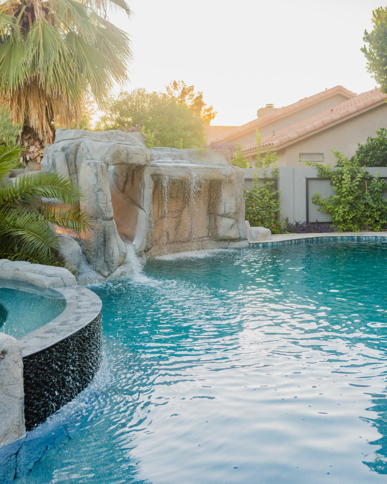 Island style pool photo in Phoenix