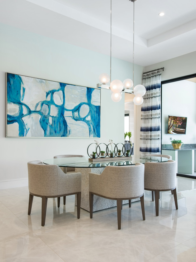 Photo of a contemporary dining room in Miami with white walls, grey floor and recessed.